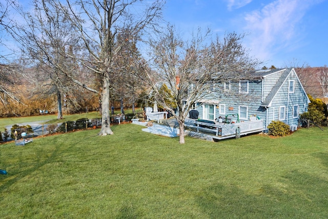 view of yard with a deck