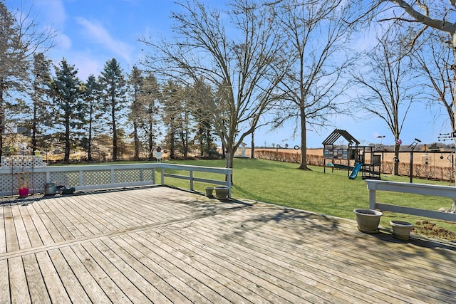 deck with playground community and a yard