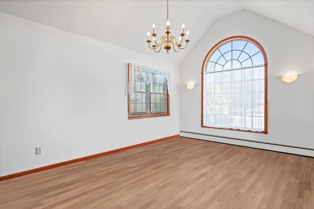 157 Pier Ave, Jamesport, NY 11901 - spare room with a chandelier, baseboard heating, lofted ceiling, and light wood-style flooring