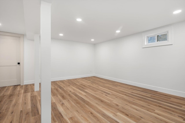 basement with light wood finished floors, baseboards, and recessed lighting