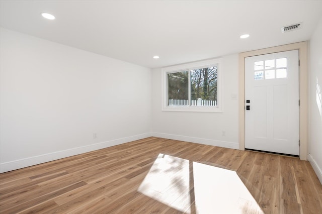 entryway featuring recessed lighting, light wood-type flooring, visible vents, and baseboards