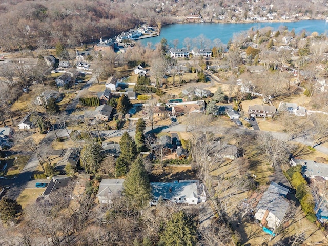 bird's eye view featuring a water view and a residential view