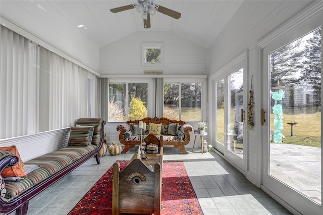 sunroom with a healthy amount of sunlight, vaulted ceiling, and a ceiling fan