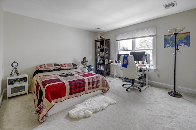 bedroom featuring baseboards, visible vents, and carpet flooring