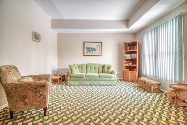 living room with carpet floors and baseboards