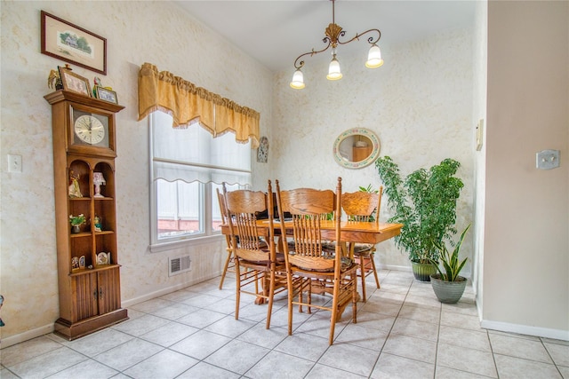 dining area with light tile patterned floors, baseboards, and visible vents