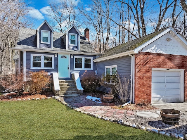 view of front of house featuring a shingled roof, brick siding, a chimney, and a front lawn