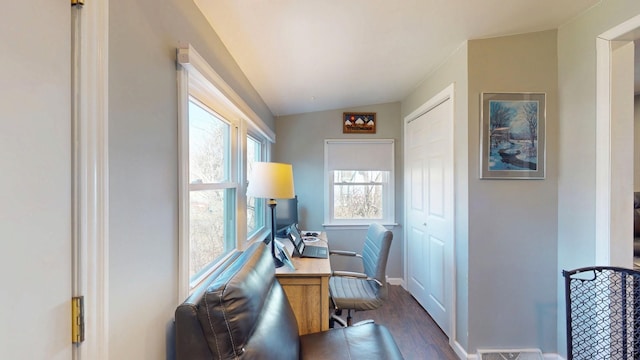 office featuring dark wood-style floors, vaulted ceiling, and baseboards