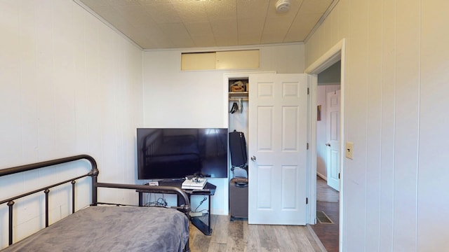 bedroom featuring wood finished floors