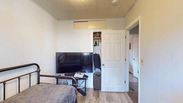 bedroom with wood finished floors