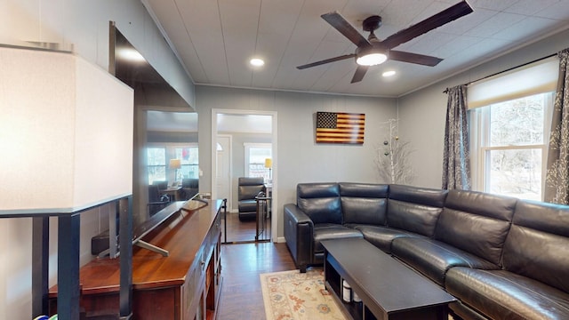 living room featuring a ceiling fan, recessed lighting, crown molding, and wood finished floors