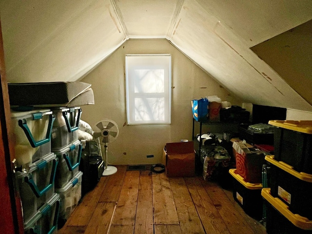 bonus room featuring lofted ceiling and wood-type flooring