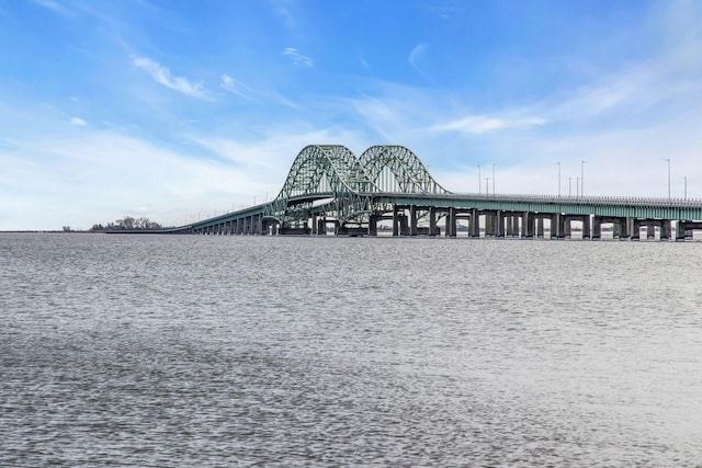 view of community featuring a pier and a water view