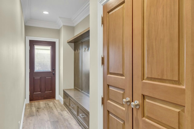 mudroom featuring light wood-style flooring, baseboards, crown molding, and recessed lighting