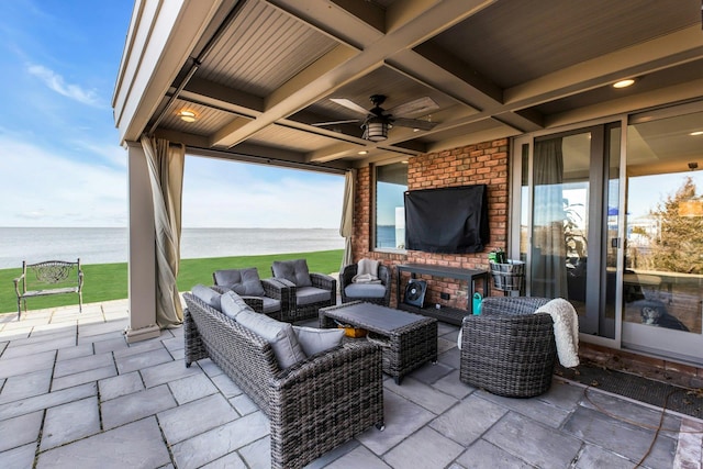 view of patio with outdoor lounge area and a ceiling fan