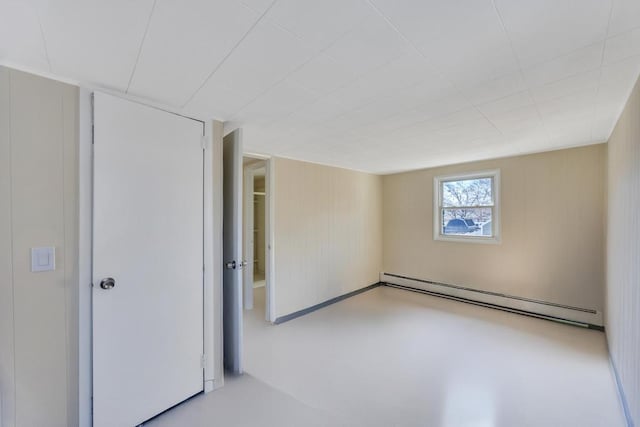 interior space with finished concrete floors and baseboard heating