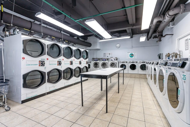 shared laundry featuring separate washer and dryer, stacked washer / dryer, and tile patterned floors