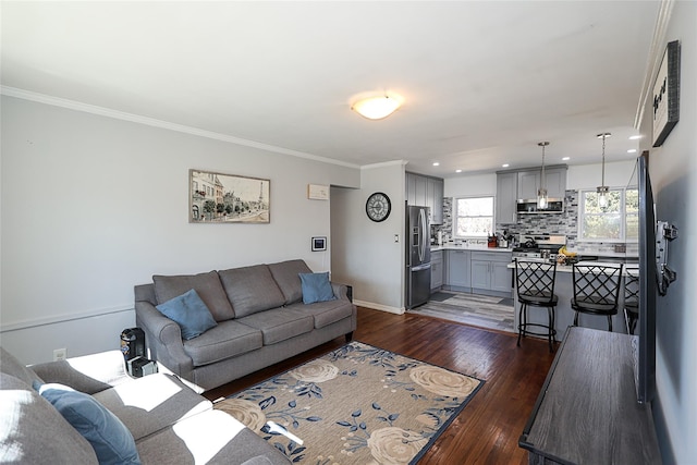 living area featuring ornamental molding, recessed lighting, dark wood finished floors, and baseboards