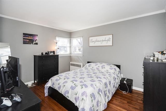 bedroom featuring dark wood-type flooring, radiator, ornamental molding, and baseboards