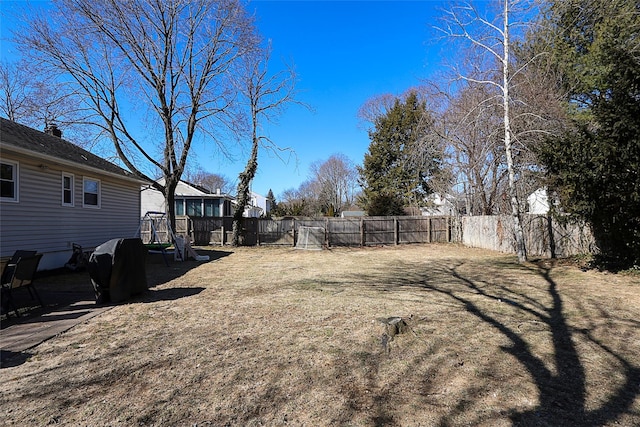 view of yard with a fenced backyard