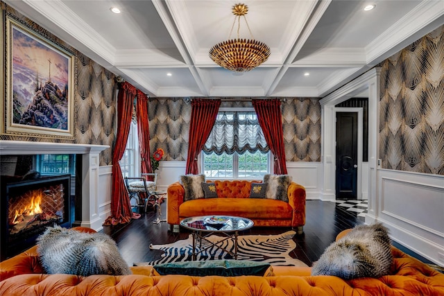 living room with wallpapered walls, a wainscoted wall, and beam ceiling
