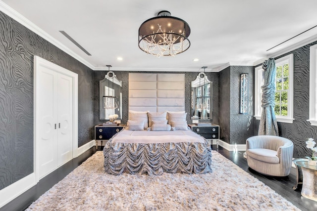 bedroom with baseboards, wallpapered walls, crown molding, and dark wood-style flooring