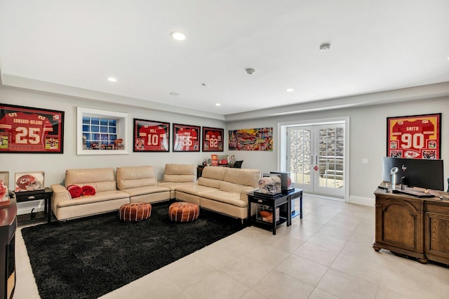 living area with french doors, light tile patterned floors, baseboards, and recessed lighting