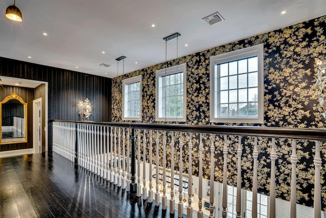 hallway with visible vents, wallpapered walls, recessed lighting, and wood finished floors