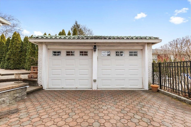 detached garage with fence