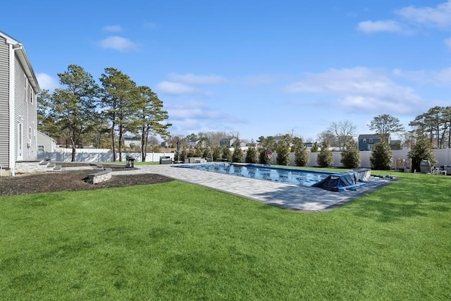 view of pool featuring a fenced in pool, a patio area, a yard, and fence