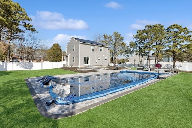 view of pool featuring a fenced in pool, a fenced backyard, a lawn, and a patio