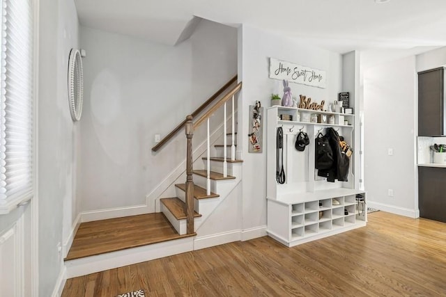 mudroom featuring baseboards and wood finished floors