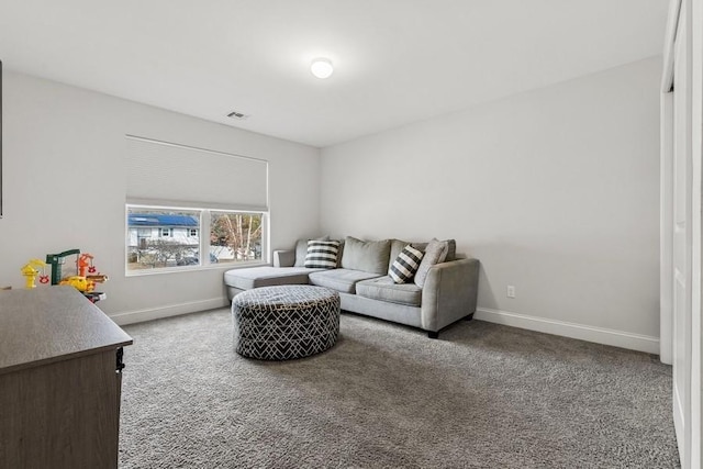 living room featuring carpet, visible vents, and baseboards