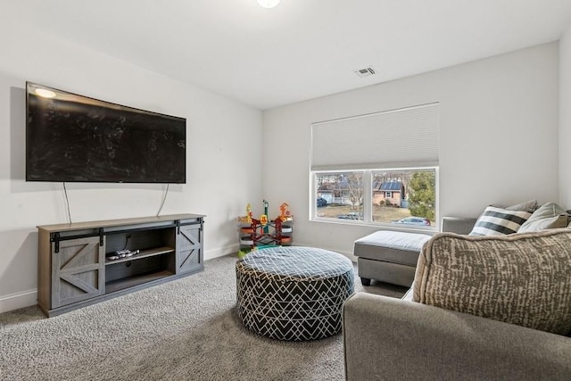 carpeted living room featuring visible vents and baseboards