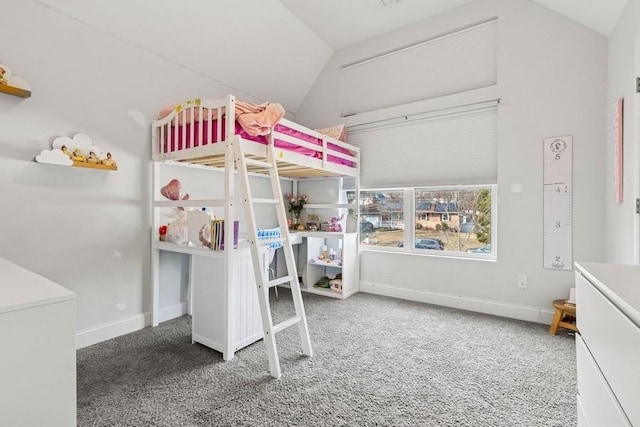 carpeted bedroom with vaulted ceiling and baseboards