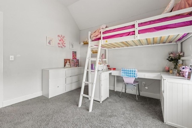 carpeted bedroom featuring baseboards and vaulted ceiling