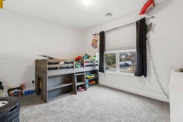 bedroom featuring baseboards, visible vents, and carpet flooring