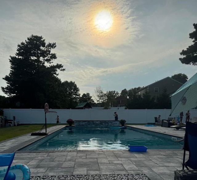 view of pool with a patio area, a fenced backyard, and a fenced in pool