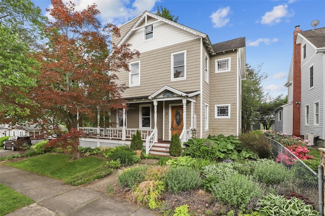 6 Agate Ave, Ossining, NY 10562 - view of front of house with a porch and a front yard