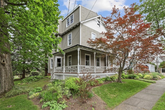 6 Agate Ave, Ossining, NY 10562 - view of front of home with covered porch and a front yard