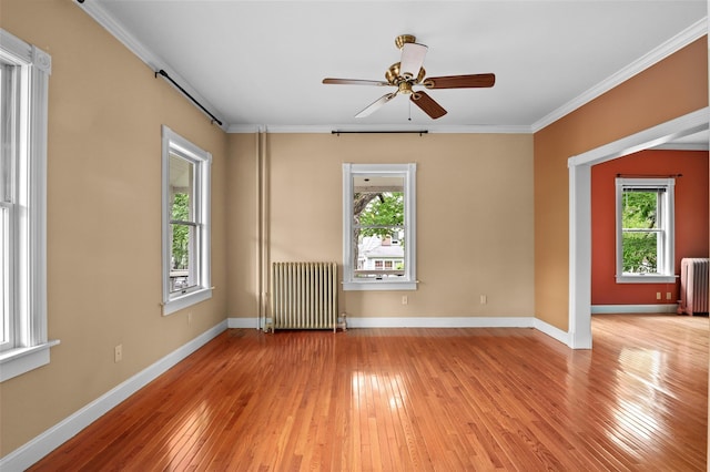 6 Agate Ave, Ossining, NY 10562 - unfurnished room with radiator, a ceiling fan, light wood finished floors, crown molding, and baseboards