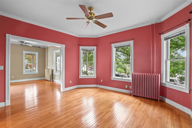 6 Agate Ave, Ossining, NY 10562 - empty room featuring radiator heating unit, a ceiling fan, light wood-type flooring, baseboards, and crown molding