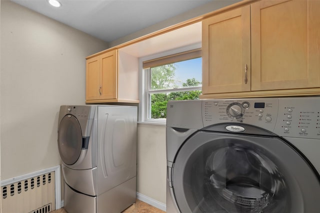 6 Agate Ave, Ossining, NY 10562 - washroom with radiator heating unit, washing machine and dryer, cabinet space, and baseboards