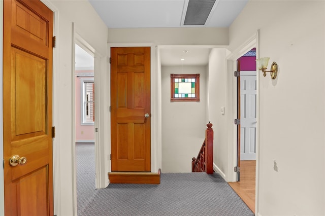 6 Agate Ave, Ossining, NY 10562 - hall with an upstairs landing, light colored carpet, and baseboards