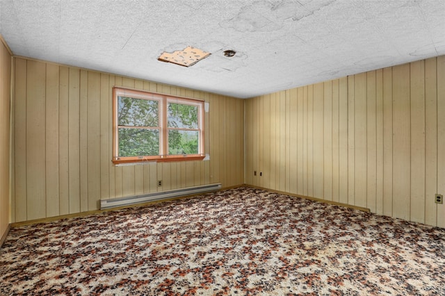 6 Agate Ave, Ossining, NY 10562 - carpeted empty room featuring a baseboard radiator and wooden walls