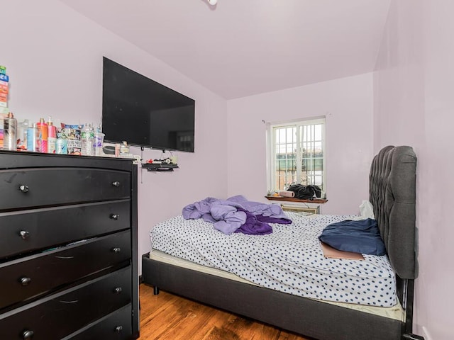 bedroom featuring wood finished floors