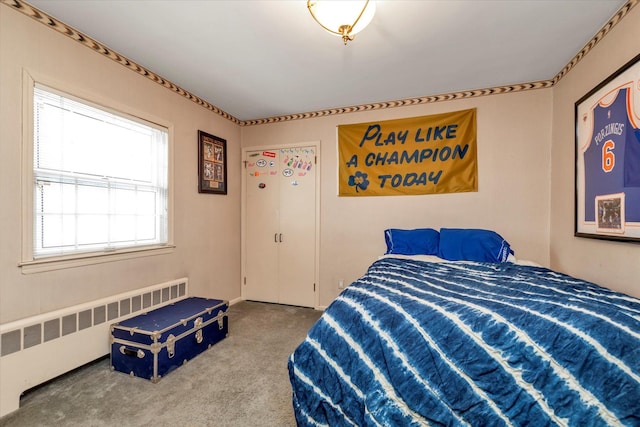 bedroom featuring carpet and radiator heating unit