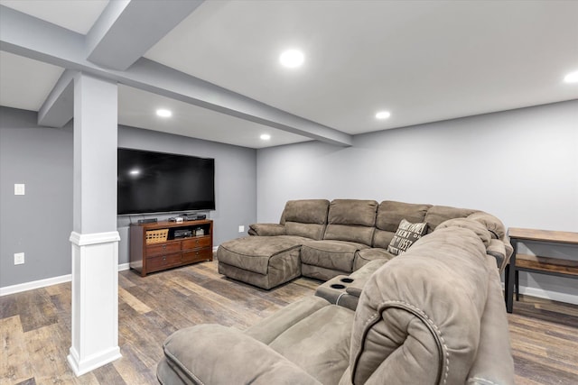 living room with decorative columns, baseboards, wood finished floors, and recessed lighting