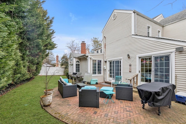 view of patio / terrace featuring fence, an outdoor living space, and grilling area