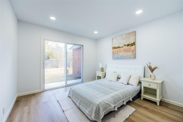 bedroom featuring access to outside, recessed lighting, baseboards, and wood finished floors